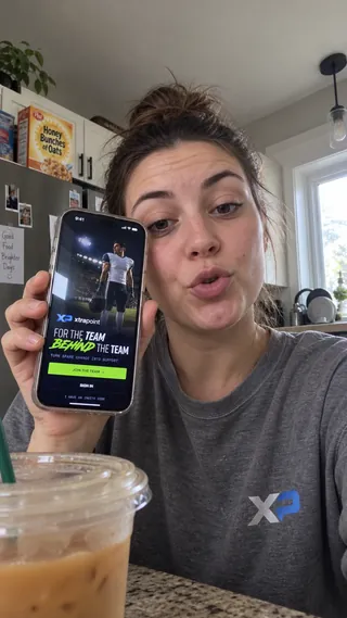 Ambassador content mockup of a student in an XtraPoint shirt sharing the program over an iced coffee.