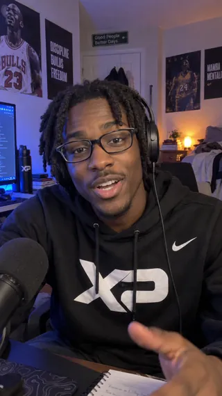Ambassador content mockup of a student wearing an XtraPoint hoodie at a bedroom streaming setup.